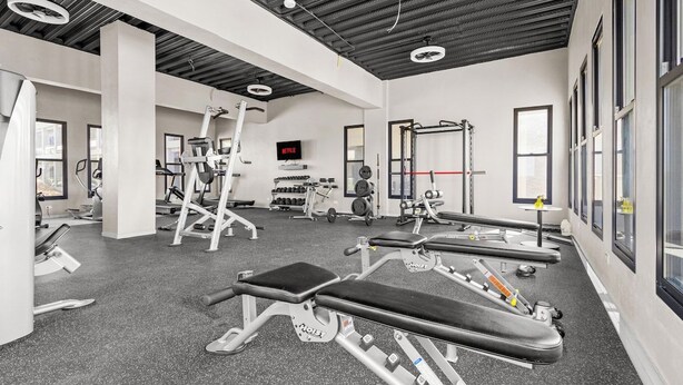 A gym with various exercise equipment, including treadmills and weight machines. - Aruba Haven: 2BR Condo w/ Balcony near Beaches (Noord)