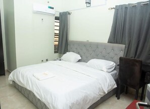 Deluxe Apartment, Balcony, City View | 2 bedrooms, in-room safe, desk, laptop workspace