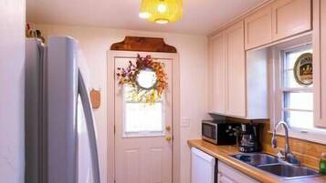 Fridge, oven, spices, dining tables