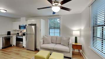 Apartment, 1 Queen Bed, Kitchen, Garden View (Secret Garden C - Pet Friendly) | Living area | 42-inch flat-screen TV with digital channels