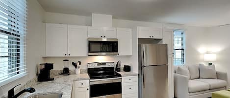 Apartment, 1 Queen Bed, Kitchen, Garden View (Secret Garden C - Pet Friendly) | Private kitchen | Fridge, microwave, oven, stovetop
