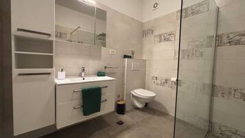 Apartment, City View | Bathroom | Shower, hair dryer, towels