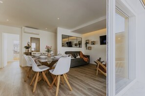 Superior Duplex, Balcony, City View | Living area | 65-inch Smart TV with cable channels