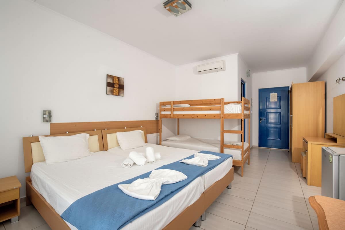 Family Quadruple Room, Partial Sea View | In-room safe, desk, soundproofing, free WiFi