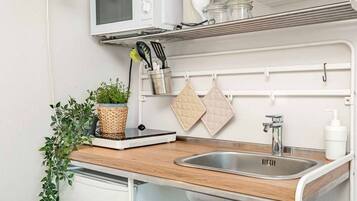 Microwave, coffee/tea maker, cookware/dishes/utensils