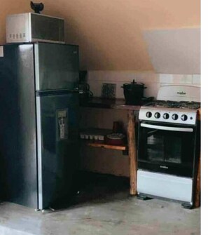 Microwave, coffee/tea maker, cookware/dishes/utensils, dining tables
