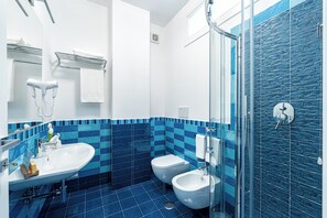 Shower, free toiletries, hair dryer, towels