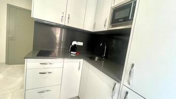 Fridge, microwave, coffee/tea maker, toaster