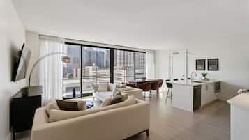 Premium Condo, 5 Bedrooms, Connecting Rooms | Living area | 55-inch Smart TV with digital channels