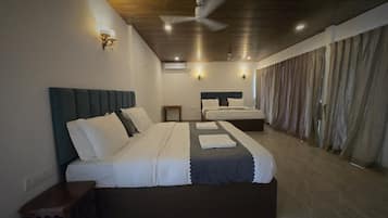 Family Room | Premium bedding, down comforters, pillowtop beds, rollaway beds