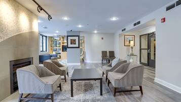 Relax in our inviting lobby, featuring a cozy fireplace and comfortable seating area.
