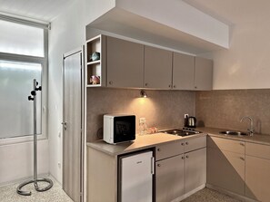 Classic Apartment, Courtyard View | Living area | 42-inch Smart TV with digital channels, Netflix, Hulu