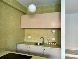Classic Apartment, Courtyard View | Private kitchen | Fridge, microwave, stovetop, espresso maker - Navigli Apartments (Milan)