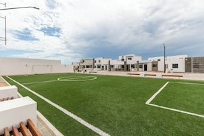 Enjoy a game of tennis or gather with friends on the well-manicured lawn.