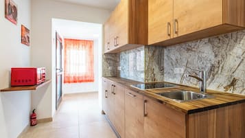 Basic Apartment | Living area | Flat-screen TV