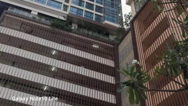 A high-rise building with a modern glass facade and a grid-like window pattern. - Capitol Twinpeaks Colombo 2 Sri Lanka Vacation rental - long term (Colombo)
