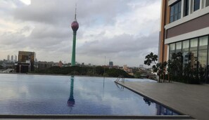 Enjoy breathtaking city views from our rooftop pool.
