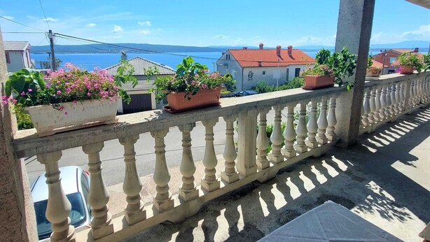 A balcony with potted plants and a view of the sea. - Elegant Apartments with Sea View and Balcony - One Bedroom Apartment with Sea View and Balcony (Crikvenica)