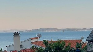 A coastal view with buildings and a clear sky.