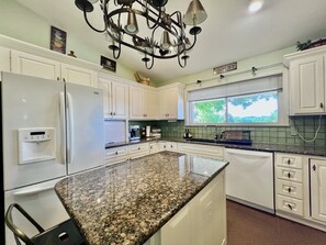 Fridge, microwave, coffee/tea maker, cookware/dishes/utensils