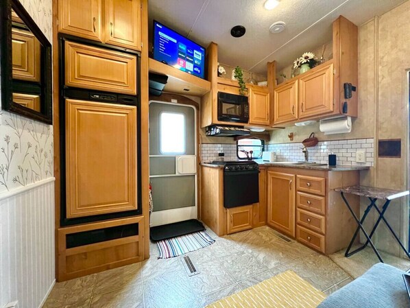 Fridge, coffee/tea maker, cookware/dishes/utensils