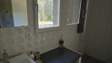Shower, hair dryer, towels, toilet paper