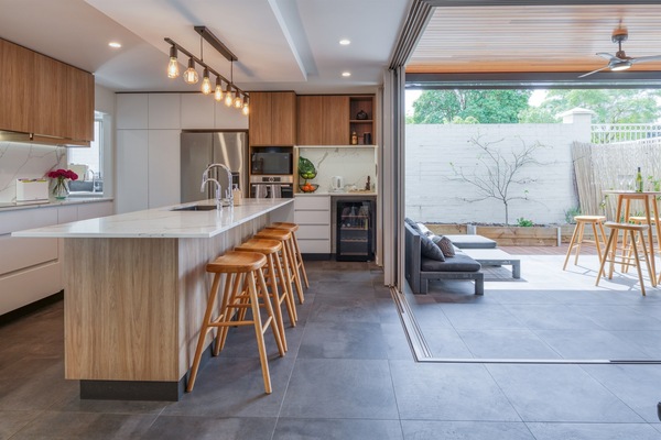An open plan kitchen with a kitchen island