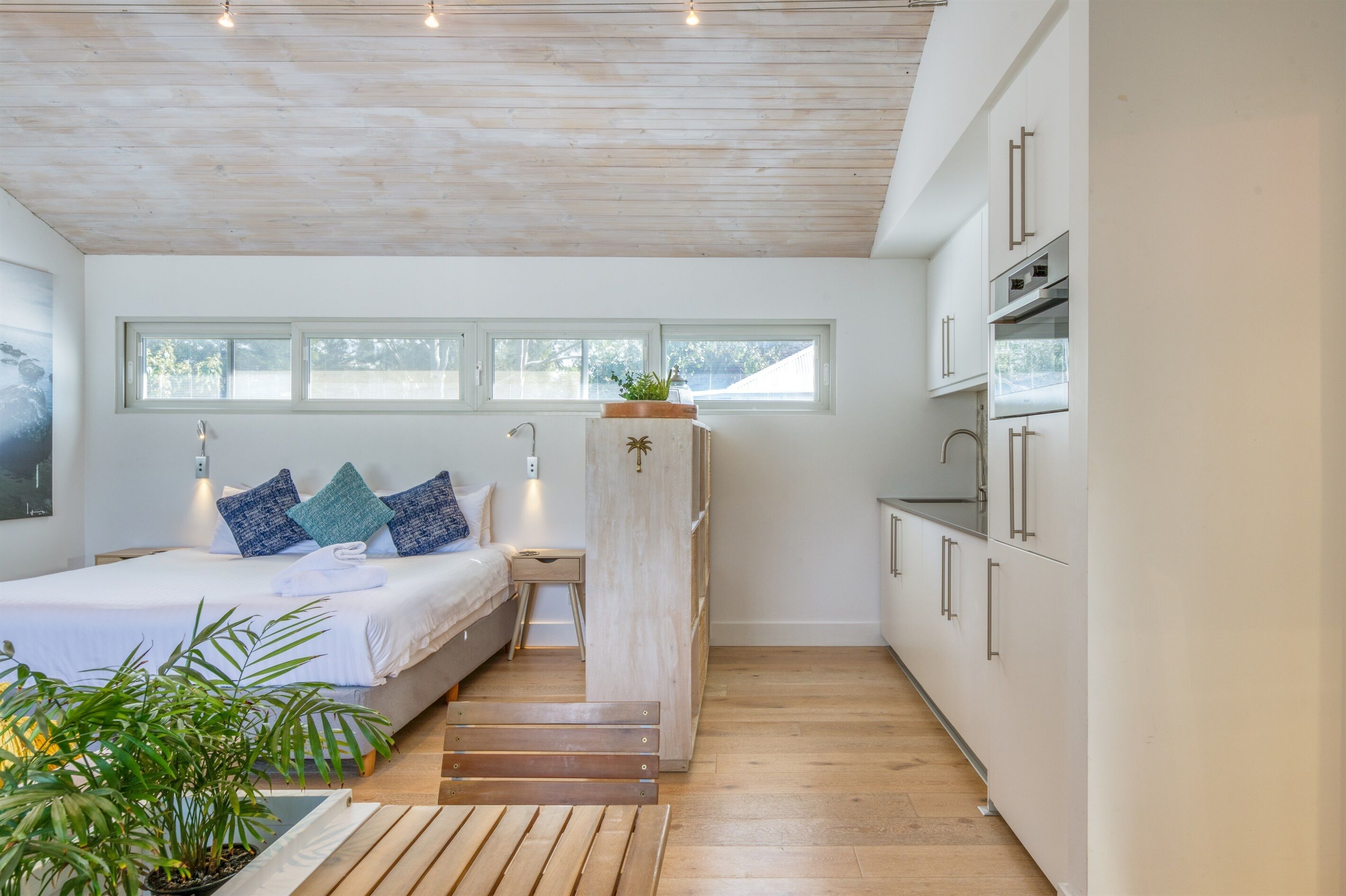 King size bed showing the kitchenette