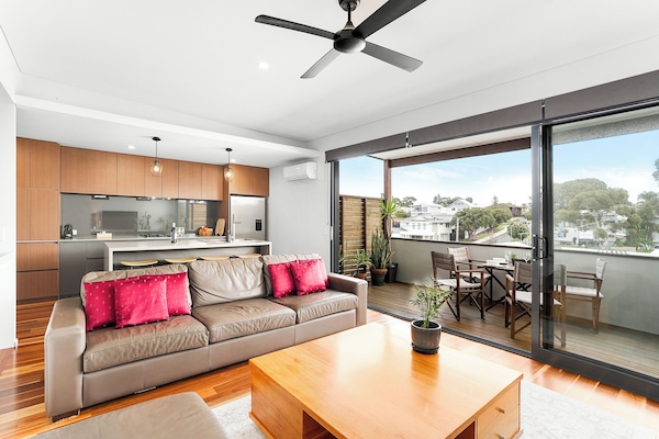 Spacious living room with direct access to the deck