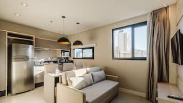 Basic Apartment | Living area | 32-inch Smart TV with digital channels, ping pong