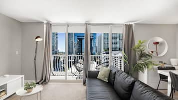 Luxury Condo, 2 Bedrooms, City View | Living area | 60-inch Smart TV with cable channels, table tennis