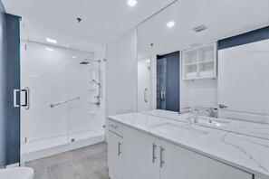 Luxury Condo, 1 Bedroom | Bathroom | Combined shower/tub, rainfall showerhead, hair dryer, towels