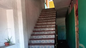 A staircase with patterned steps leading to a landing. - Hostal Luna Vallarta (Puerto Vallarta)