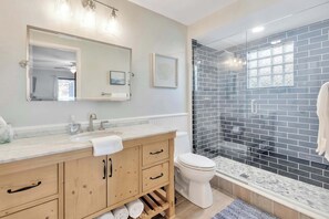Shower, hair dryer, towels, shampoo
