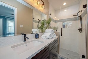 Shower, towels, soap, toilet paper