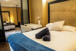2 habitaciones, tabla de planchar con plancha y ropa de cama
