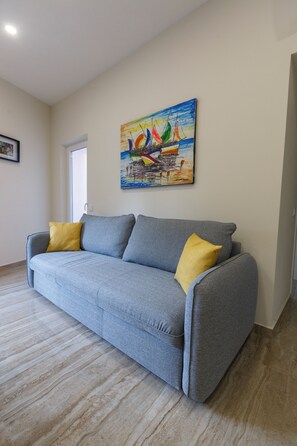 Luxury Apartment, 2 Bedrooms, Balcony, City View | Living area | 4055-inch Smart TV with digital channels - Solar Mendonca Boutique Hotel (Faro)