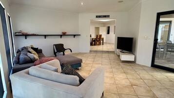 House, Multiple Beds, Non Smoking, Partial Ocean View | Living area | 56-inch TV with digital channels