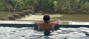 3-bedroom farmhouse in charming Kharivali with AC, WiFi. Enjoy a cozy stay