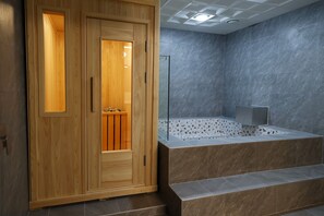 Separate tub and shower, deep soaking tub, rainfall showerhead, towels