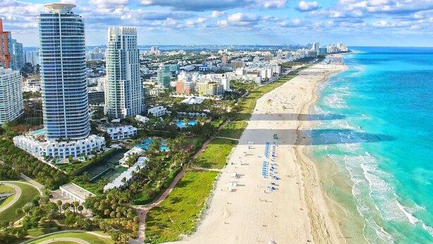 A coastal cityscape with high-rise buildings, a beach, and a clear sky. - Designer Studio | Close to Wynwood | Design District  | Downtown (Miami)