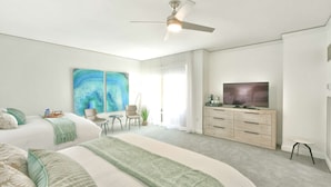 A modern bedroom with a large bed, a TV, and a ceiling fan. - W Hotel SOUTH BEACH 1B RESIDENCE w/OCEAN VIEW - 909 (Key Biscayne Miami)