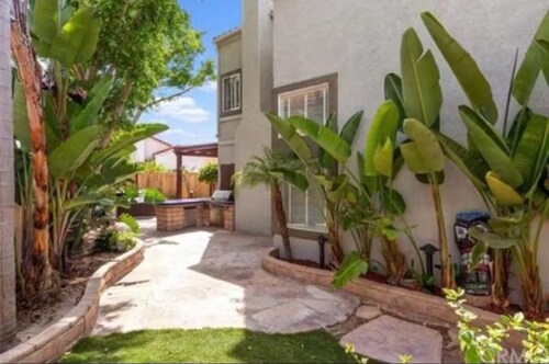 Spacious 4-bedroom house with hot tub and spa-like backyard. Home away from home