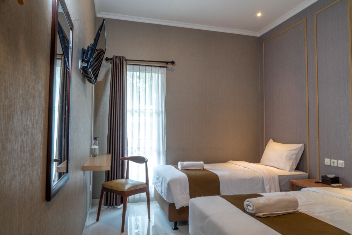 Habitación Deluxe con 1 cama doble o 2 individuales, vistas al jardín | Escritorio, wifi gratis, ropa de cama