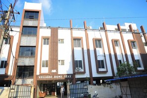 A multi-story building with a sign reading "Vellore Home Stay". - AK Vellore Stays  (Vellore)