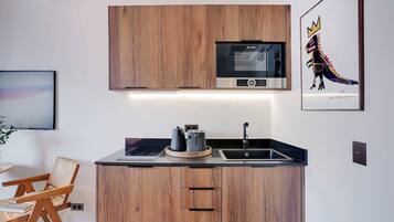 Fridge, microwave, stovetop, coffee/tea maker