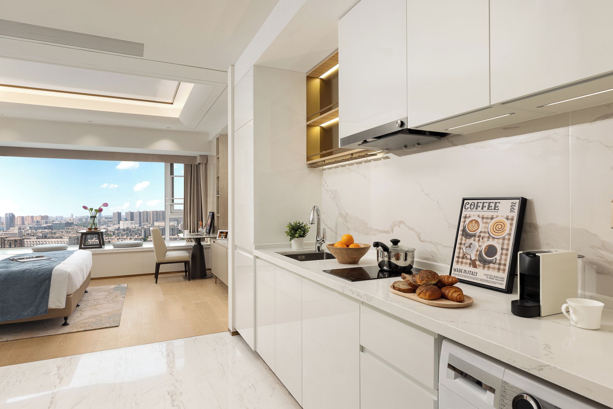 A modern kitchen with a city view, a dining area with a table and chairs, and a bed with a view.
