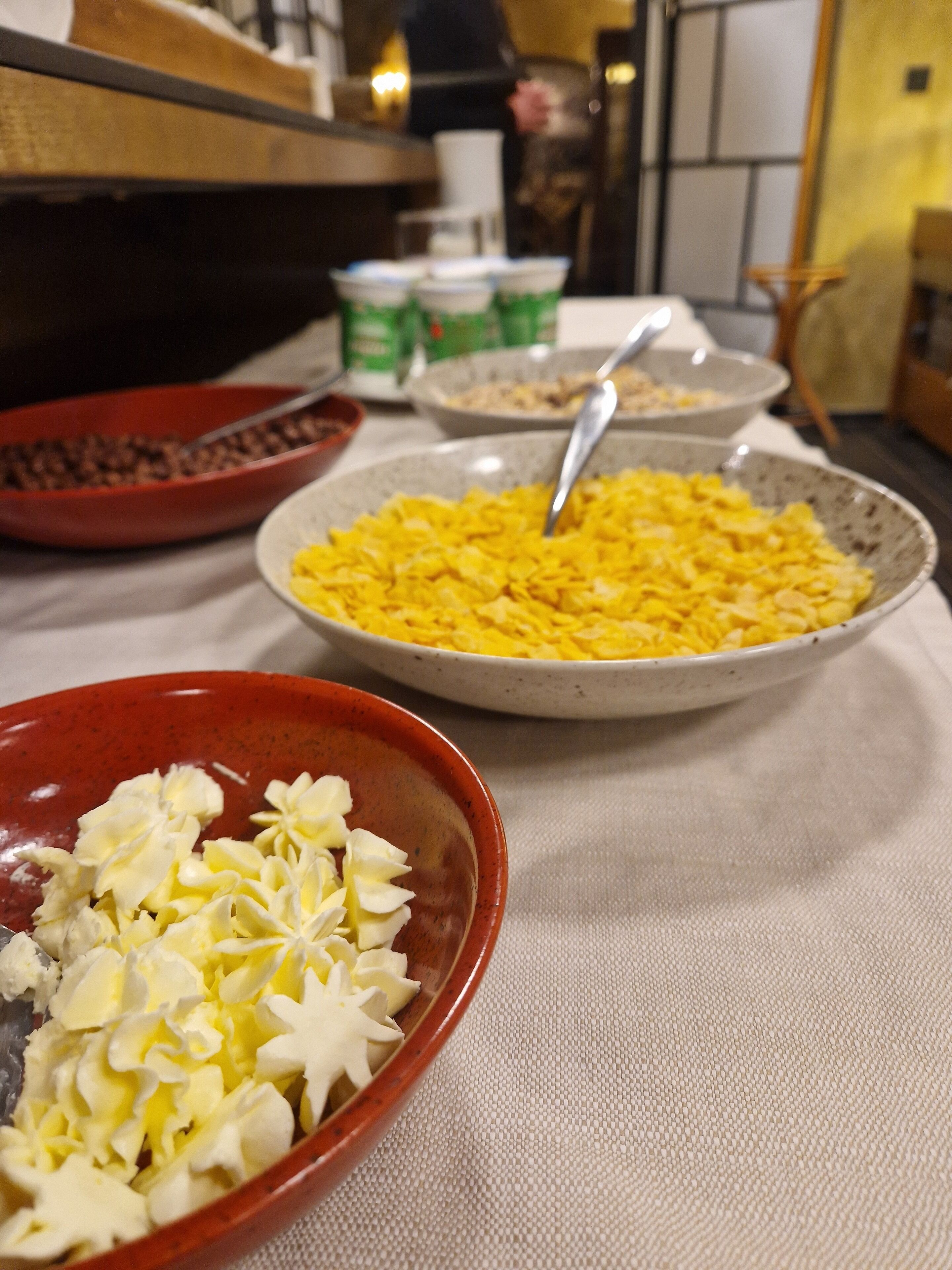 A table with various bowls containing food items.