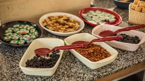 A buffet with various food items and serving utensils. - Büyük Mardin Otel (Mardin)