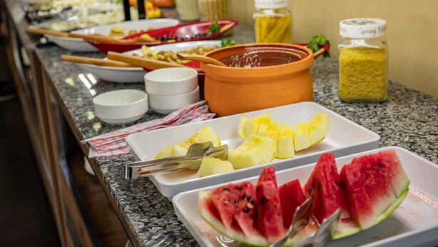 A buffet with various food items and condiments. - Büyük Mardin Otel (Mardin)